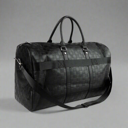 Black woven duffel bag on a white background