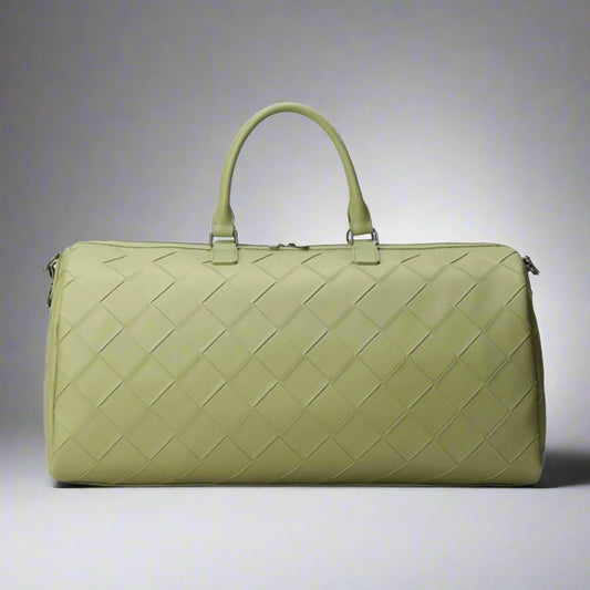 Green woven duffel bag on a white background