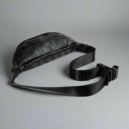 Black waist bag with a strap on a white background