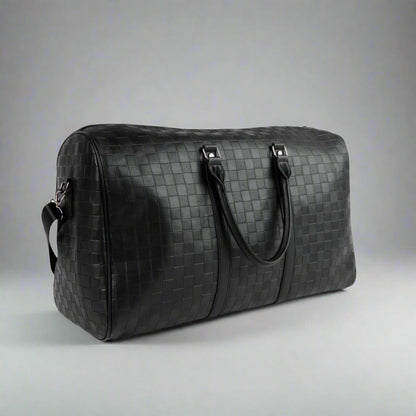 Black woven duffel bag on a white background