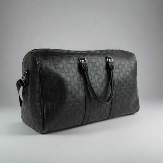 Black woven duffel bag on a white background