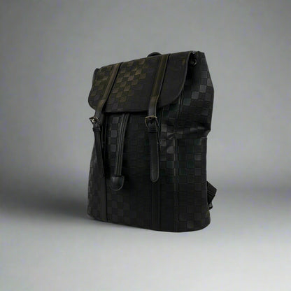 Black backpack on a white table with a white background