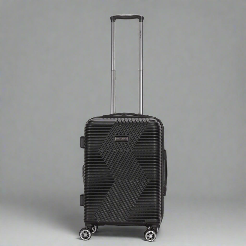 Black suitcase with geometric pattern on a white background