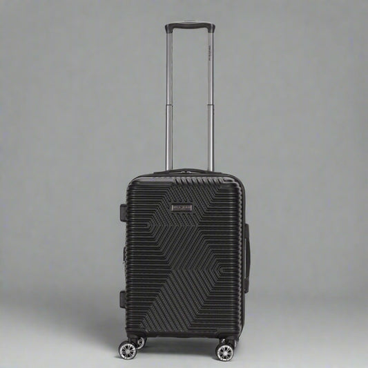 Black suitcase with geometric pattern on a white background