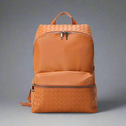 Brown woven backpack on a white background