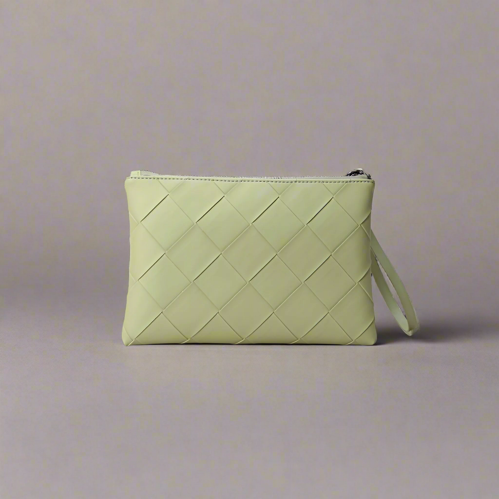 Light green woven clutch bag on a white background