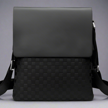 Black woven leather crossbody bag on a white background