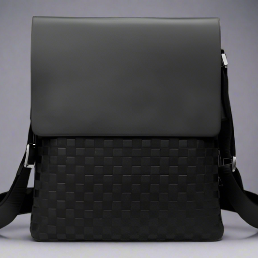 Black woven leather crossbody bag on a white background